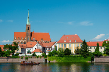 Wroclaw, Poland. View with river Oder and Church on the other side of the river. Island Tumski, old town.