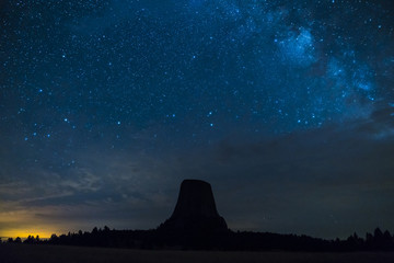 beautiful devil tower at night with milkyway in clear night sky. wyoming,usa.