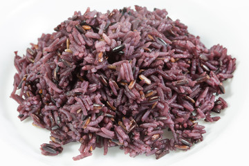 Organic cooked rice black rice, berry rice or black jasmine rice on white background, in hearty concept.