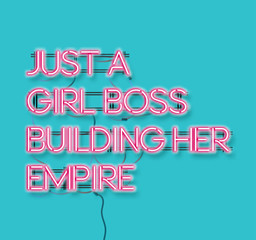 Just a girl boss building her empire pink neon signon blue background.  Modern feminism quote isolated on blue background. Modern design art for poster, greeting card etc