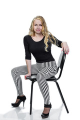 Fototapeta premium young blonde girl posing on chair.