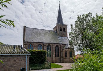 Fototapeta premium Village church of 't Woudt. A very old village (from 1277) in the province South Holland in the Netherlands. The village hardly changed over the years.