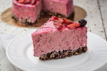Strawberry Cake dessert with vanilla cream on wooden background