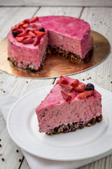 Strawberry Cake dessert with vanilla cream on wooden background