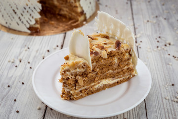 White Chocolate vegane cake with nuts and cream. Birthday concept