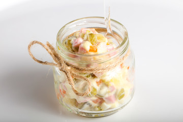 Russian salad in the glass can