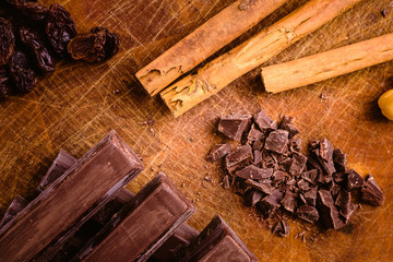 Plate of black chocolate chips with cinnamon and hazelnuts