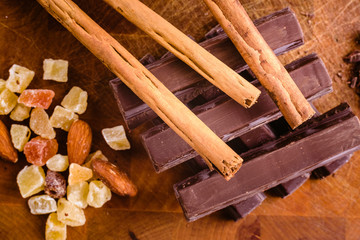 Plate of black chocolate chips with cinnamon and hazelnuts