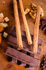 Plate of black chocolate chips with cinnamon and hazelnuts