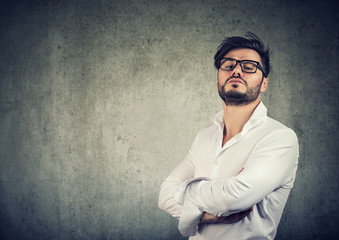 Overconfident stylish man in glasses