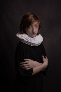 Studio portrait of boy wearing neck ruff