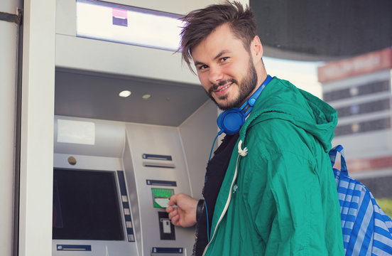 Content Man Using ATM Machine Successfully