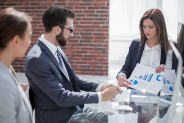 business team is discussing the financial report