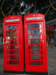Fototapeta na wymiar Red telephone Boxes on the Rock of Gibraltar at the entrance to the Mediterranean Sea