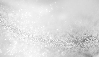 Abstract of Bright and sparkling bokeh background. silver and diamond dust bokeh blurred lighting from glitter texture