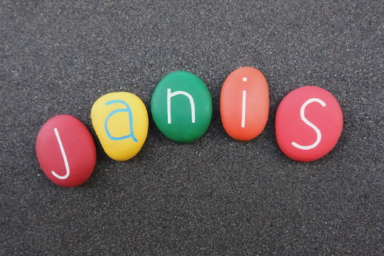 Janis, feminine give name with colored stones over black volcanic sand