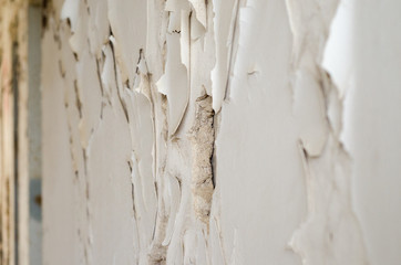 peeled wall plaster and cracks