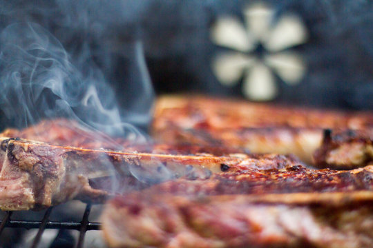 Steak Cooking On An Open Grill