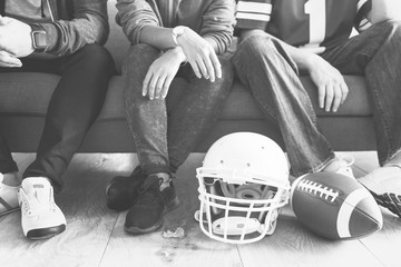 Friends watching sports in the living room
