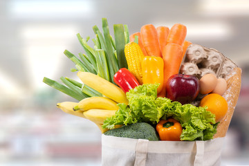 Eco day use shopping bag with vegetables grocery shopping in supermarket