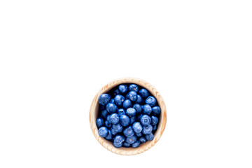 Fresh recently picked blueberries in bowl on white background top view copy space