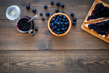 Bluberry toast for breakfast on dark wooden background top view space for text
