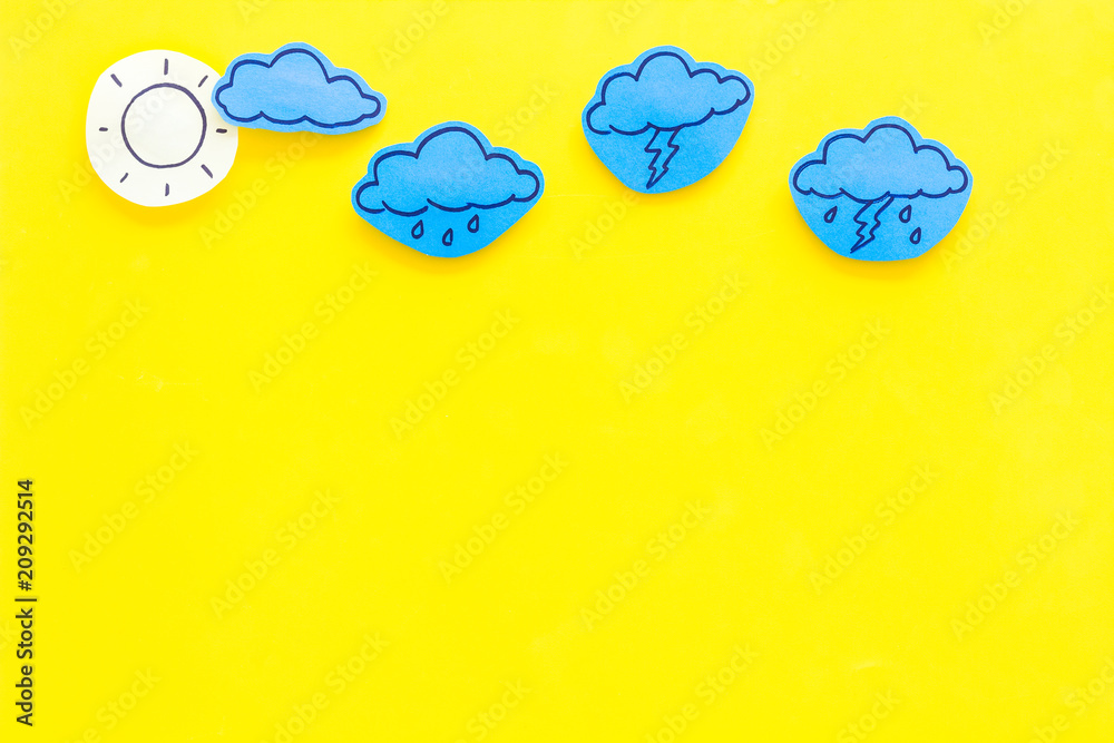 Wall mural modern weather icons set on yellow background top view copy space