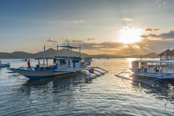 Traditional boat at terrace cafe at Coron Town at sunset view in Busuanga Island Palawan Philippines.