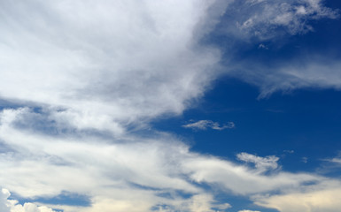 Naklejka na ściany i meble White cloud in blue sky