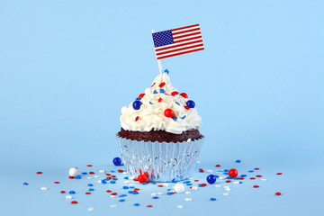 4th of July cupcake with flag and sprinkles - Powered by Adobe