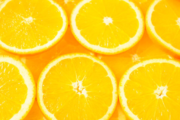 A cut of orange fruit slice pattern background.