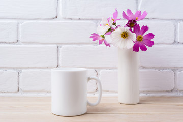 White coffee mug mockup with white and pink daisy