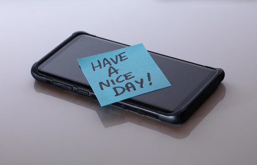 cell phone note says have anice day