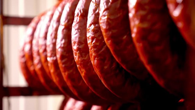 Smoked sausage in the oven. Sausage production in the factory.