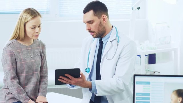 Beautiful Female Visits Doctor's Office,  He Shows Tablet Computer with Her Medical History They Discuss Her Health and Other Medical Issues. Modern Medical Office. Shot on RED EPIC-W 8K.