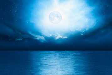 Night sky with full moon and reflection in sea,  "Elements of this image furnished by NASA"   © muratart