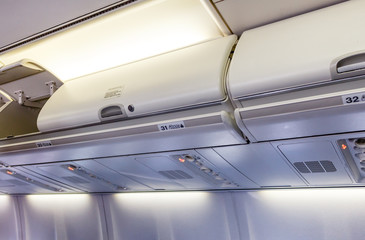 Overhead compartment - detail of an airplane cabin interior