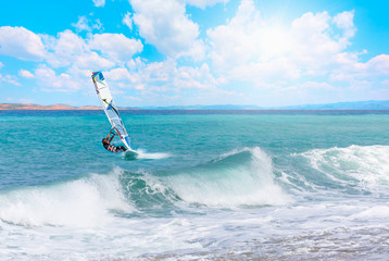 Beautiful cloudy sky with Windsurfer Surfing The Wind On Waves - Alacati, izmir