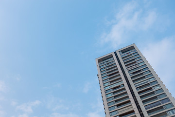 Look up at the tall buildings and the sky