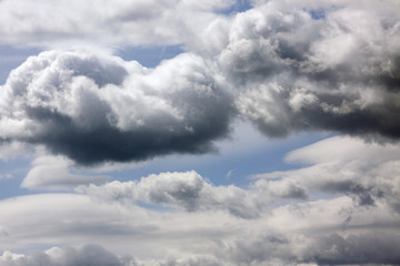 Dark clouds in a blue sky