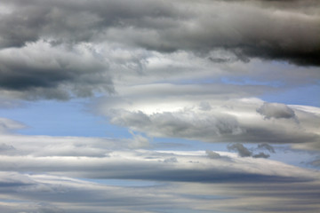 Dark clouds in a blue sky