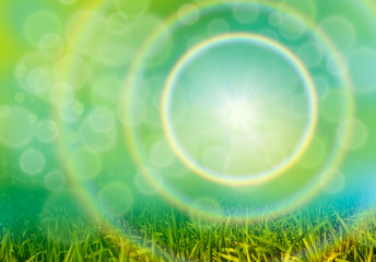 Obraz premium Green grass background with bokeh and rainbow