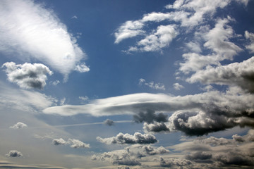 Dark clouds in a blue sky