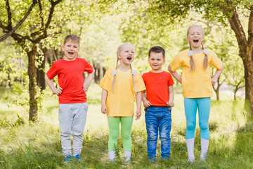 happy kids in colorful t-shirts outdoors