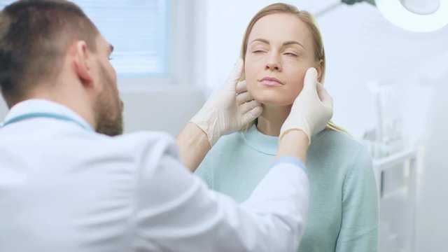 Plastic / Cosmetic Surgeon Examines Beautiful Woman's Face, Touches it with Gloved Hands, Inspecting Healed Face after Plastic Surgery with Amazing Results. Shot on RED EPIC-W 8K Helium Cinema Camera.
