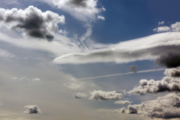 Dark clouds in a blue sky