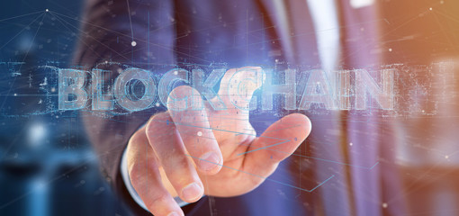 Businessman holding a Blockchain title isolated on a background