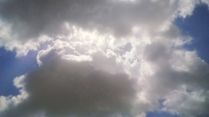 Obraz premium sun light passing through dark clouds ,sky, clouds, nature, storm, weather, sun, dark, light, blue, cloudy, rain, dramatic, heaven, cloudscape, overcast, day, stormy, atmosphere, sunlight, white