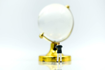 Miniature people : Businessman with glass globe.