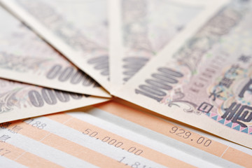 Close up saving account passbook and new Japanese yen
